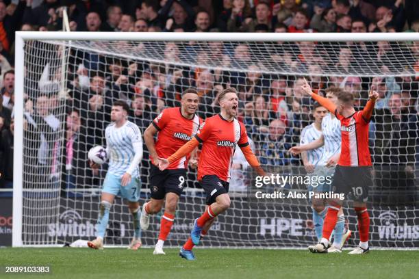 Luke Berry of Luton Town celebrates scoring his sides first goal during the Premier League match between Luton Town and Nottingham Forest at...
