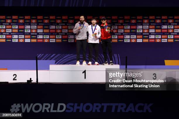 Denis Nikisha of Kazakhstan poses with the silver medal, Xiaojun Lin of China with the gold medal and Jordan Pierre-Gilles of Canada with the bronze...
