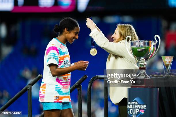 Naomi Girma of San Diego Wave FC receives her medal after the 2024 NWSL Challenge Cup against NJ/NY Gotham FC at Red Bull Arena on March 15, 2024 in...