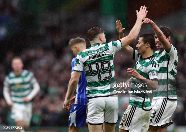 James Forrest of Celtic celebrates after he scores his team's third goal during the Cinch Scottish Premiership match between Celtic FC and St....