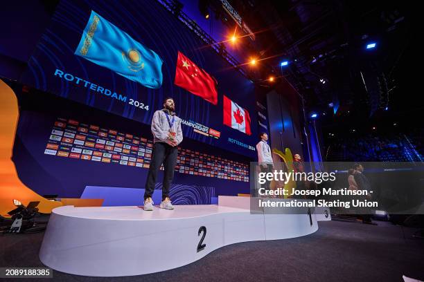 Denis Nikisha of Kazakhstan poses with the silver medal, Xiaojun Lin of China with the gold medal and Jordan Pierre-Gilles of Canada with the bronze...