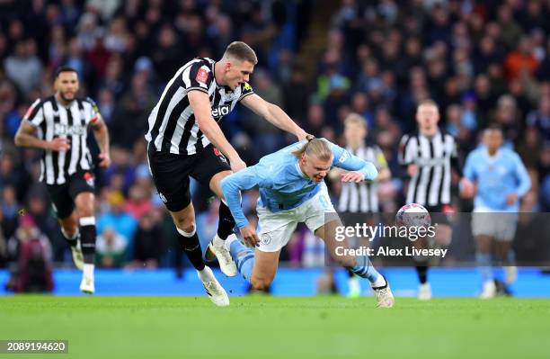 Erling Haaland of Manchester City is challenged by Sven Botman of Newcastle United during the Emirates FA Cup Quarter Final match between Manchester...