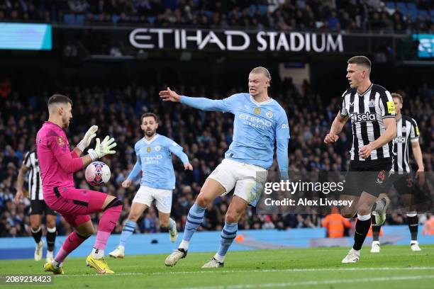 Martin Dubravka of Newcastle United makes a save from Erling Haaland of Manchester City during the Emirates FA Cup Quarter Final match between...