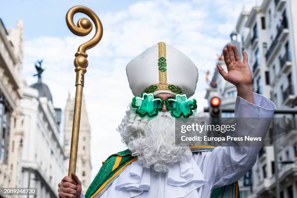 Person in costume during the parade for St. Patrick's Day, March 16 in Madrid, Spain. During the parade, 500 pipers march through the streets of...