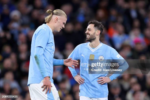 Bernardo Silva of Manchester City celebrates scoring his team's second goal with teammate Erling Haaland during the Emirates FA Cup Quarter Final...