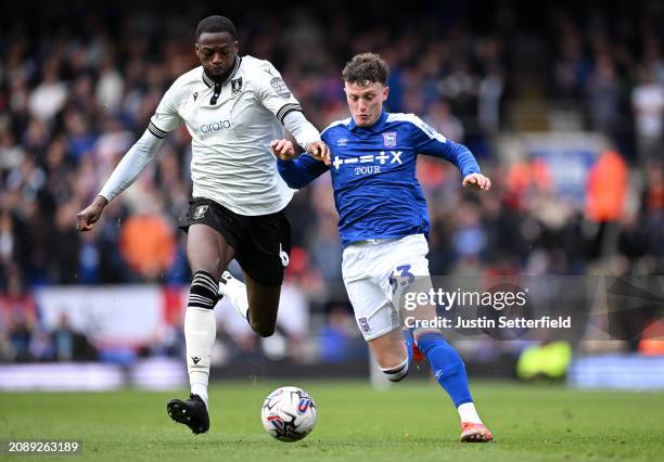 Nathan Broadhead of Ipswich Town and Dominic Iorfa of Sheffield Wednesday compete for the ball during the Sky Bet Championship match between Ipswich...