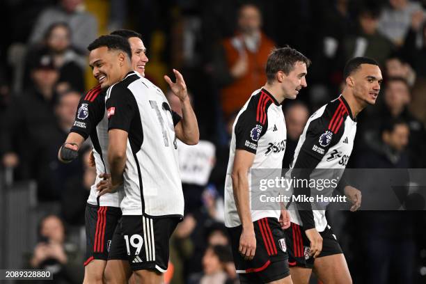 Sasa Lukic of Fulham celebrates scoring his team's second goal with teammate Rodrigo Muniz during the Premier League match between Fulham FC and...