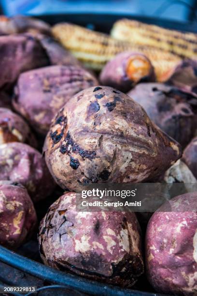 chinese roast sweet potatoes - yam plant stock pictures, royalty-free photos & images