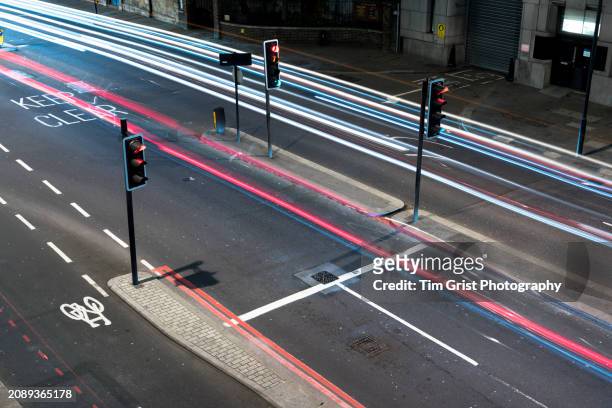 light trials on a city street at night - vehicle light stock pictures, royalty-free photos & images