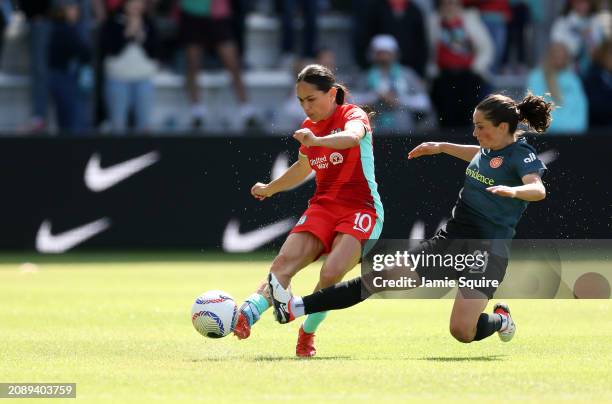 Lo'eau LaBonta of the Kansas City Current and Jessie Fleming of the Portland Thorns FC compete for the ball during the opening match at CPKC Stadium,...