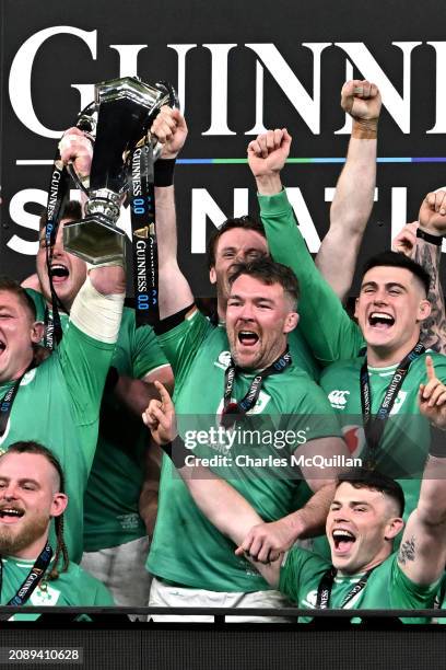 Peter O'Mahony of Ireland lifts the Six Nations Trophy following the team's victory during the Guinness Six Nations 2024 match between Ireland and...