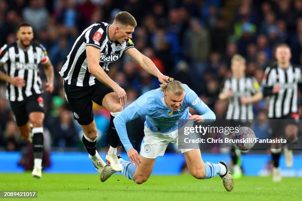 Erling Haaland of Manchester City in action with Sven Botman of Newcastle United during the Emirates FA Cup Quarter Final match between Manchester...