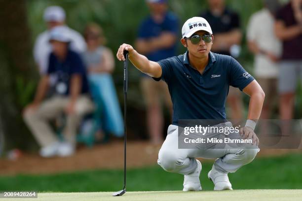 Pan of Taiwan lines up a putt on the ninth green during the third round of THE PLAYERS Championship at TPC Sawgrass on March 16, 2024 in Ponte Vedra...