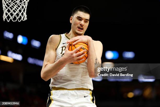 Zach Edey of the Purdue Boilermakers rebounds the ball against the Wisconsin Badgers in the second half at Target Center in the Semifinals of the Big...