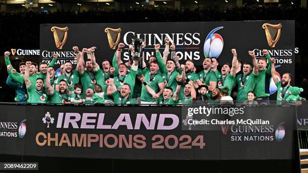 Tadhg Furlong and Peter O'Mahony of Ireland lift the Six Nations Trophy following the team's victory during the Guinness Six Nations 2024 match...