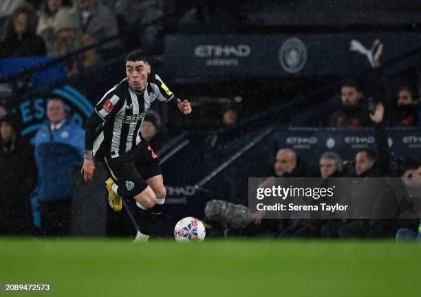 Miguel Almirón of Newcastle United FC runs with the ball during the Emirates FA Cup Quarter Final at the Etihad Stadium on March 16, 2024 in...