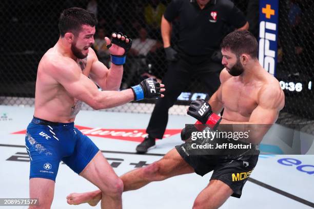 Thiago Moises of Brazil kicks Mitch Ramirez in their lightweight fight during the UFC Fight Night event at UFC APEX on March 16, 2024 in Las Vegas,...