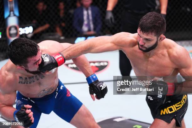 Thiago Moises of Brazil punches Mitch Ramirez in their lightweight fight during the UFC Fight Night event at UFC APEX on March 16, 2024 in Las Vegas,...