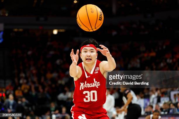 Keisei Tominaga of the Nebraska Cornhuskers rebounds the ball against the Illinois Fighting Illini in the first half at Target Center in the...