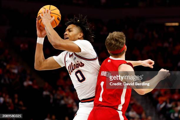 Terrence Shannon Jr. #0 of the Illinois Fighting Illini goes to the basket against Sam Hoiberg of the Nebraska Cornhuskers in the first half at...