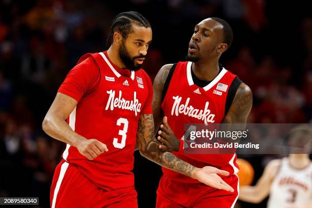 Brice Williams of the Nebraska Cornhuskers celebrates his basket against the Illinois Fighting Illini with teammate Juwan Gary in the first half at...