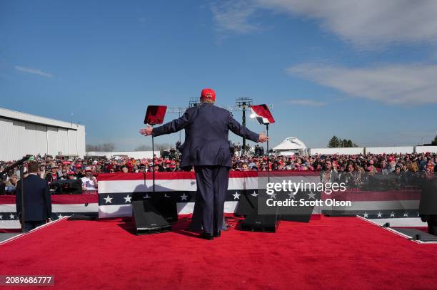 Republican presidential candidate former President Donald Trump speaks to supporters during a rally at the Dayton International Airport on March 16,...