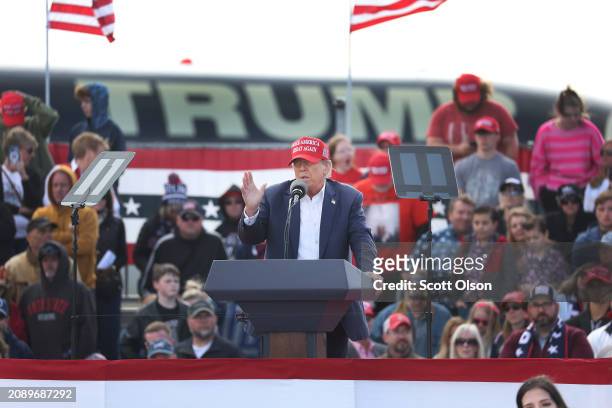 Republican presidential candidate former President Donald Trump speaks to supporters during a rally at the Dayton International Airport on March 16,...