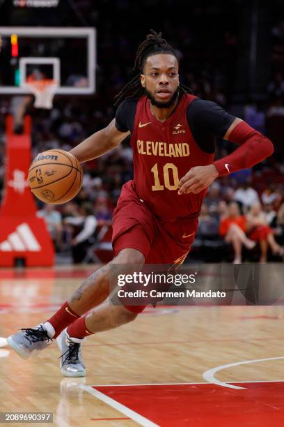 Darius Garland of the Cleveland Cavaliers drives against the Houston Rockets during the first half at Toyota Center on March 16, 2024 in Houston,...