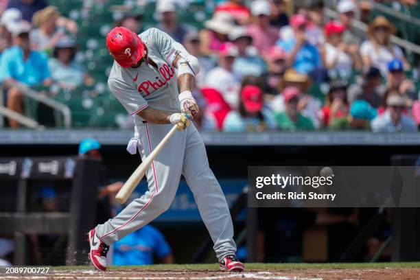 Nick Castellanos of the Philadelphia Phillies at bat during a spring training game against the Miami Marlins at Roger Dean Stadium on March 16, 2024...