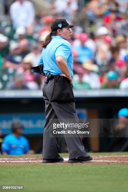 Umpire Jen Pawol looks on during a spring training game between the Philadelphia Phillies and the Miami Marlins at Roger Dean Stadium on March 16,...