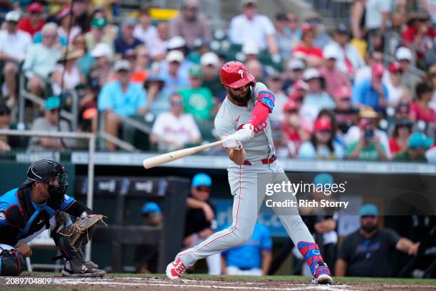 Weston Wilson of the Philadelphia Phillies at bat during a spring training game against the Miami Marlins at Roger Dean Stadium on March 16, 2024 in...