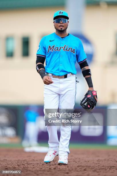 Luis Arraez of the Miami Marlins looks on during a spring training game against the Philadelphia Phillies at Roger Dean Stadium on March 16, 2024 in...