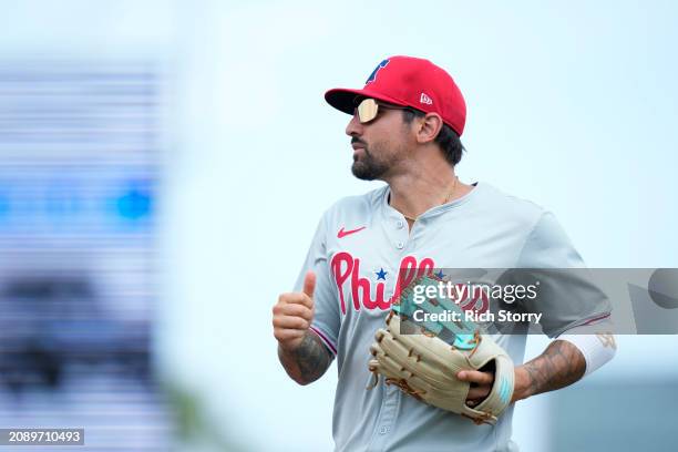 Nick Castellanos of the Philadelphia Phillies looks on during a spring training game against the Miami Marlins at Roger Dean Stadium on March 16,...