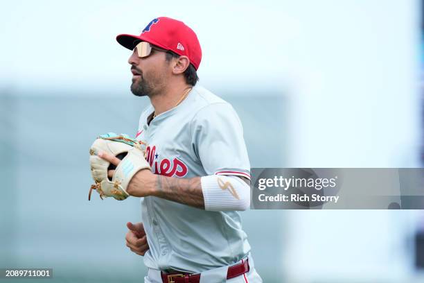 Nick Castellanos of the Philadelphia Phillies looks on during a spring training game against the Miami Marlins at Roger Dean Stadium on March 16,...