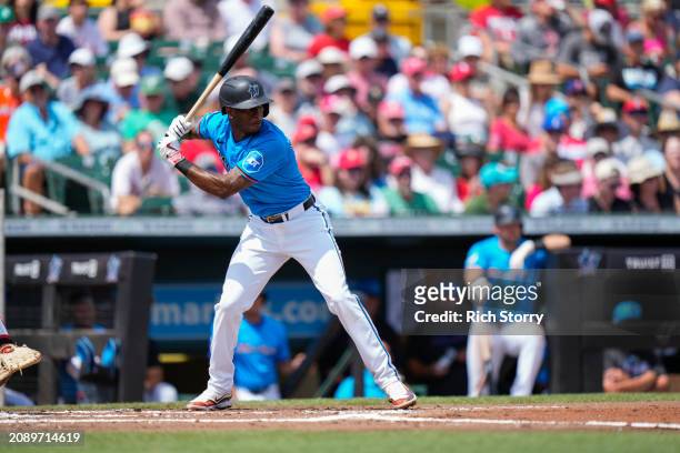Tim Anderson of the Miami Marlins at bat during a spring training game against the Philadelphia Phillies at Roger Dean Stadium on March 16, 2024 in...