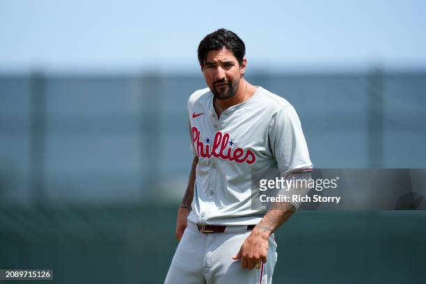 Nick Castellanos of the Philadelphia Phillies looks on during a spring training game against the Miami Marlins at Roger Dean Stadium on March 16,...
