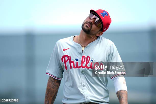 Nick Castellanos of the Philadelphia Phillies looks on prior to a spring training game against the Miami Marlins at Roger Dean Stadium on March 16,...