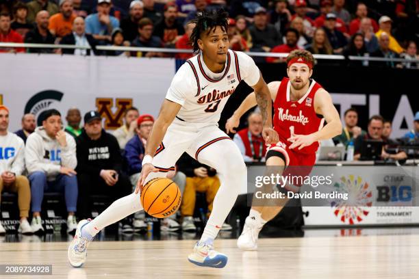 Terrence Shannon Jr. #0 of the Illinois Fighting Illini goes to the basket past Sam Hoiberg of the Nebraska Cornhuskers in the first half at Target...