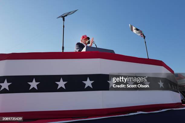 Republican presidential candidate former President Donald Trump speaks to supporters during a rally at the Dayton International Airport on March 16,...