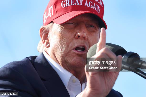 Republican presidential candidate former President Donald Trump speaks to supporters during a rally at the Dayton International Airport on March 16,...