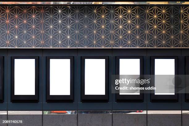 display of blank billboards against a wall in central london - electronic billboard stock pictures, royalty-free photos & images
