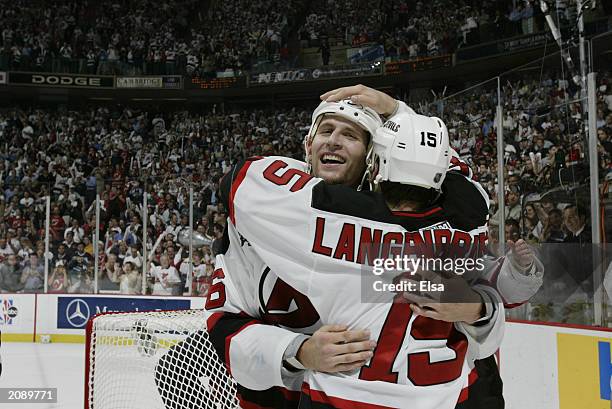 Mike Rupp of the New Jersey Devils hugs Jamie Langenbrunner after defeating the Mighty Ducks of Anaheim 3-0 in game seven of the 2003 Stanley Cup...