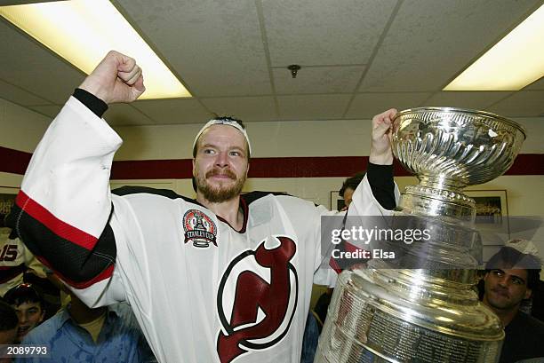 Turner Stevenson of the New Jersey Devils celebrates in the locker room with the Stanley Cup after defeating the Mighty Ducks of Anaheim 3-0 in game...