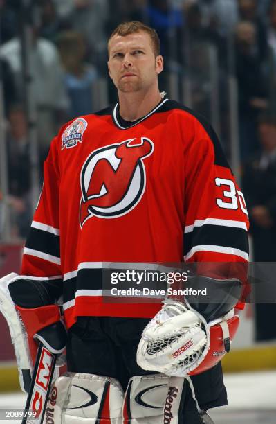 Martin Brodeur of the New Jersey Devils looks on during a break in action against the Mighty Ducks of Anaheim in Game Six of the 2003 Stanley Cup...