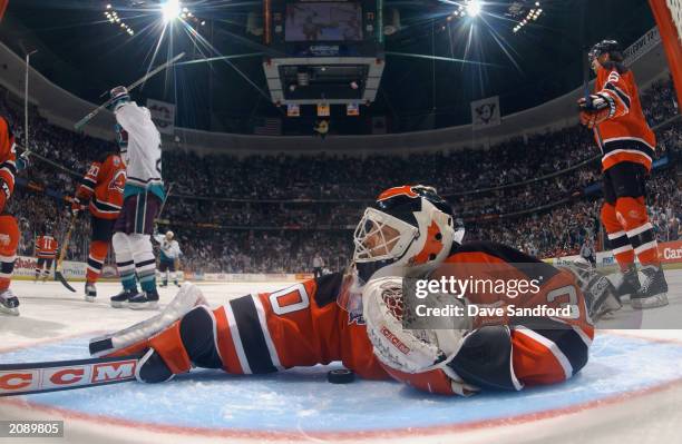 Martin Brodeur of the New Jersey Devils can't stop the puck as Petr Sykora of the Mighty Ducks of Anaheim scored the final goal for the Ducks in Game...