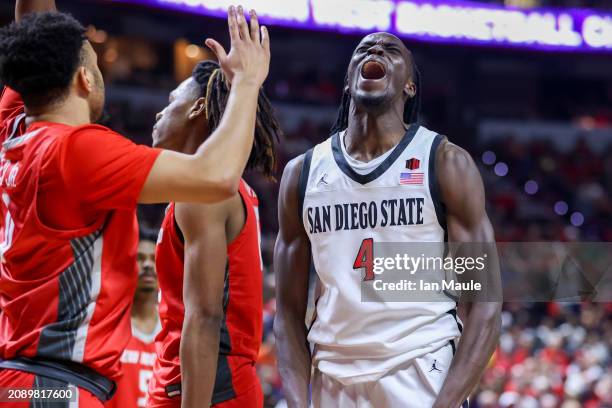 Jay Pal of the San Diego State Aztecs yells after making a basket while being fouled against the New Mexico Lobos during the first half of the...