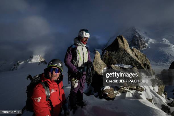 French mountaineer Charles Dubouloz and French skipper Jeremie Beyou congratulate each other at the end of a mountaineering day, in the Mont Blanc...