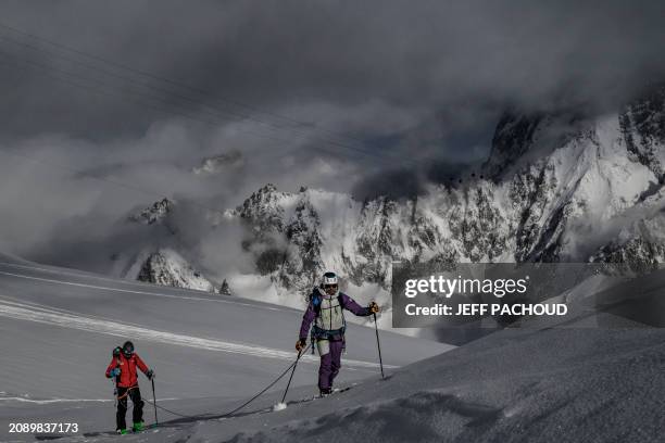 French mountaineer Charles Dubouloz and French skipper Jeremie Beyou climb the Glacier Du Geant near the Aiguille du Midi, in the Mont Blanc Massif...