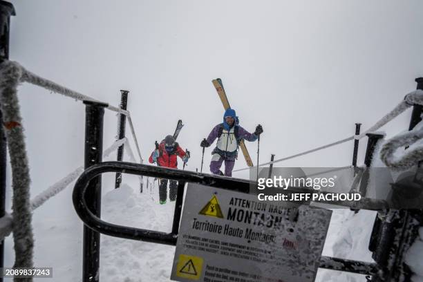 French mountaineer Charles Dubouloz and French skipper Jeremie Beyou walk on the Aiguille du Midi ridge, in the Mont Blanc Massif, around Chamonix,...