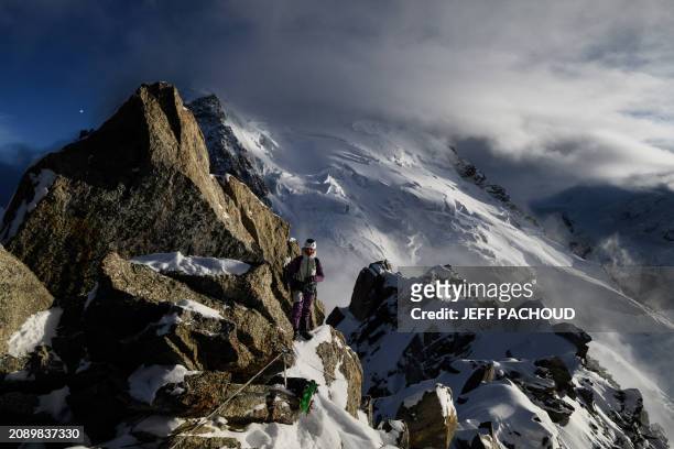 French mountaineer Charles Dubouloz and French skipper Jeremie Beyou stand on a ridge of the Glacier Du Geant near the Cosmiques hut, in the Mont...
